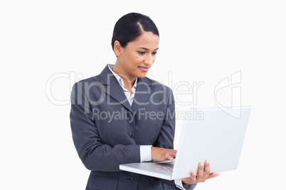 Close up of saleswoman using her laptop