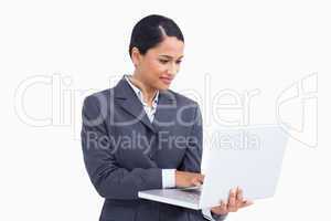 Close up of saleswoman using her laptop