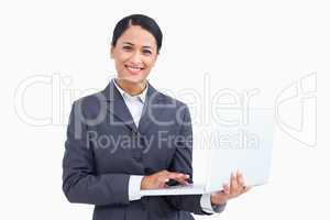 Close up of smiling saleswoman with her notebook