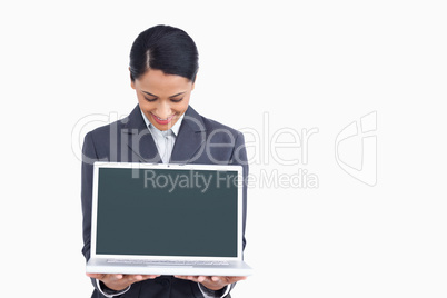 Close up of saleswoman showing notebook screen