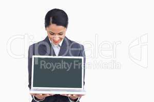 Close up of saleswoman showing notebook screen