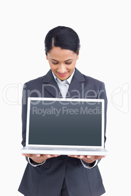 Close up of saleswoman presenting screen of her laptop