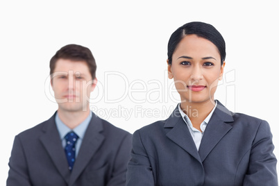 Close up of confident saleswoman with colleague behind her