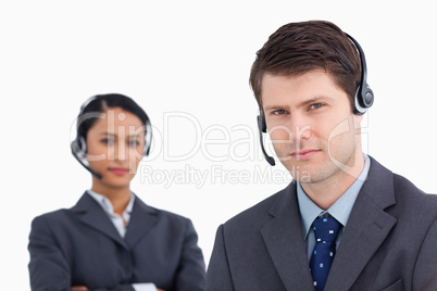 Close up of serious looking call center agents Close up of serious looking call center agents