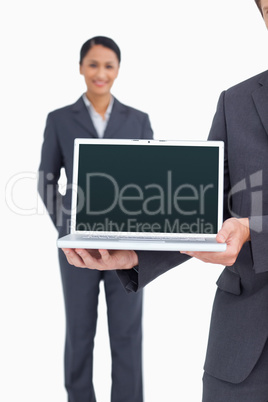 Close up of laptop being presented by salesteam