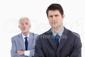 Close up of businessman with his boss behind him