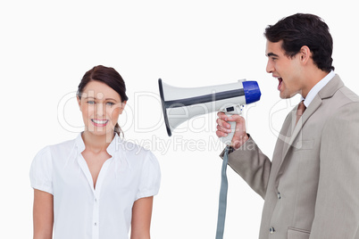 Salesman yelling at colleague with megaphone