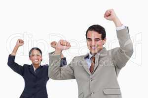 Celebrating salesman with colleague behind him