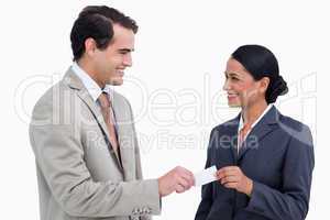 Smiling business people exchanging business cards