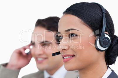 Close up side view of call center agents