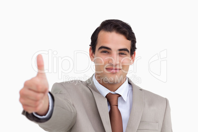 Close up of young salesman giving thumb up