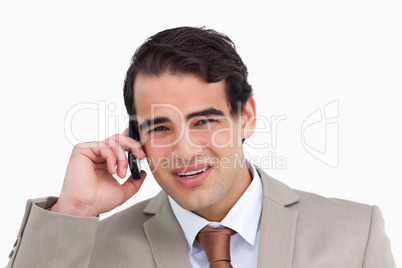 Close up of annoyed young salesman on his cellphone