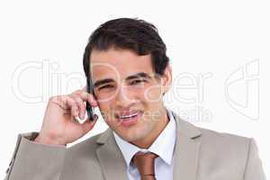 Close up of annoyed young salesman on his cellphone