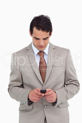 Salesman looking at his cellphone