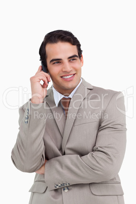 Smiling salesman on his cellphone