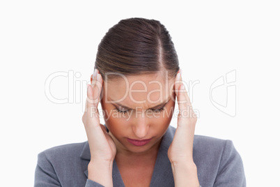 Close up of tradeswoman experiencing a headache