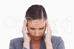 Close up of tradeswoman experiencing a headache