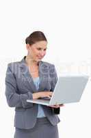 Tradeswoman working on her laptop