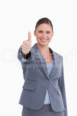 Thumb up given by smiling saleswoman