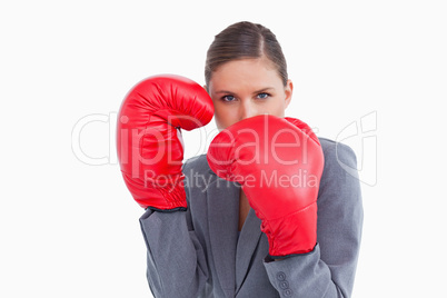 Tradeswoman with boxing gloves in defensive position