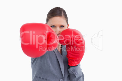Tradeswoman with boxing gloves attacking