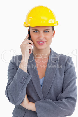 Smiling female architect on her cellphone