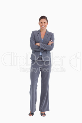 Smiling tradeswoman with her arms folded