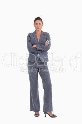 Tradeswoman standing with her arms folded