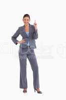 Smiling tradeswoman pointing up