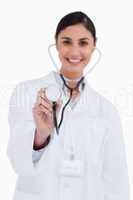 Stethoscope being used by smiling female doctor