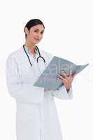 Smiling female doctor with patients record
