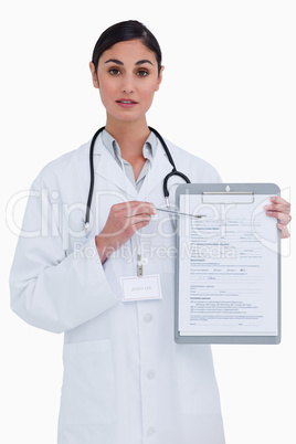Female doctor pointing at form