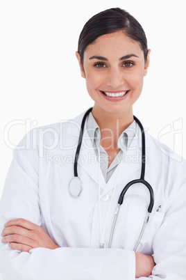 Close up of smiling female doctor with her arms folded