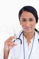Close up of female doctor with syringe