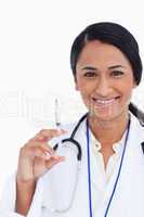 Close up of smiling female doctor with syringe