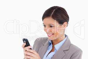 Close up of smiling female entrepreneur reading text message