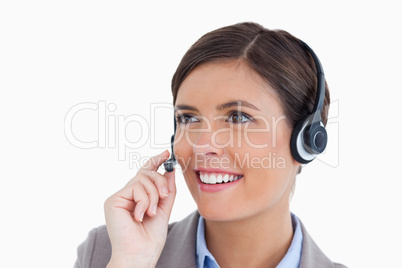 Close up of smiling female call center agent with headset