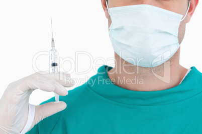 Close up of male doctor with syringe wearing scrubs