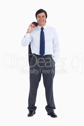 Smiling tradesman with jacket over his shoulder