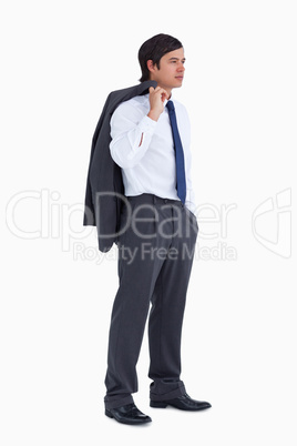 Side view of young tradesman with jacket over his shoulder