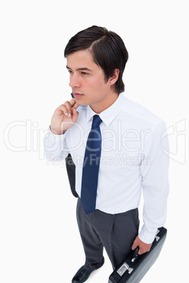 Young tradesman with his jacket and suitcase