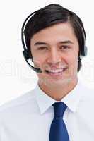 Close up of male telephone support employee with headset on