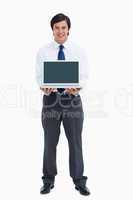 Smiling tradesman presenting screen of his laptop