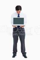 Tradesman looking at laptop screen he is presenting