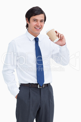 Smiling tradesman with paper cup