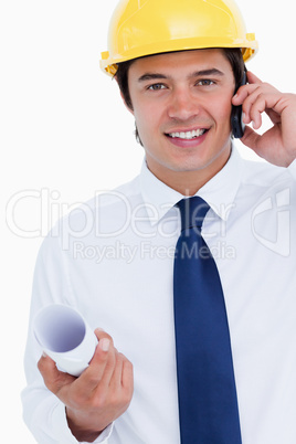 Close up of smiling male architect on his cellphone