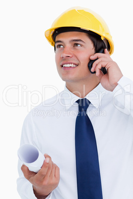 Close up of smiling architect talking on his cellphone