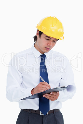 Close up of male architect taking notes