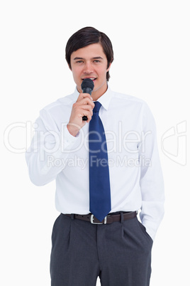 Young tradesman talking with microphone