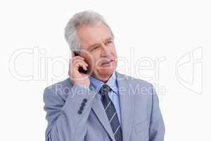 Close up of mature tradesman talking on his cellphone